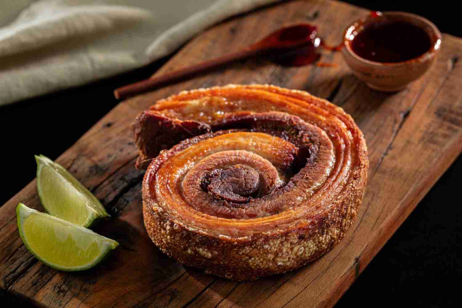 Mastering Asian-Style Pork Belly Recipes 1 Photograph of a Fried Pork Belly on a Wooden Chopping Board