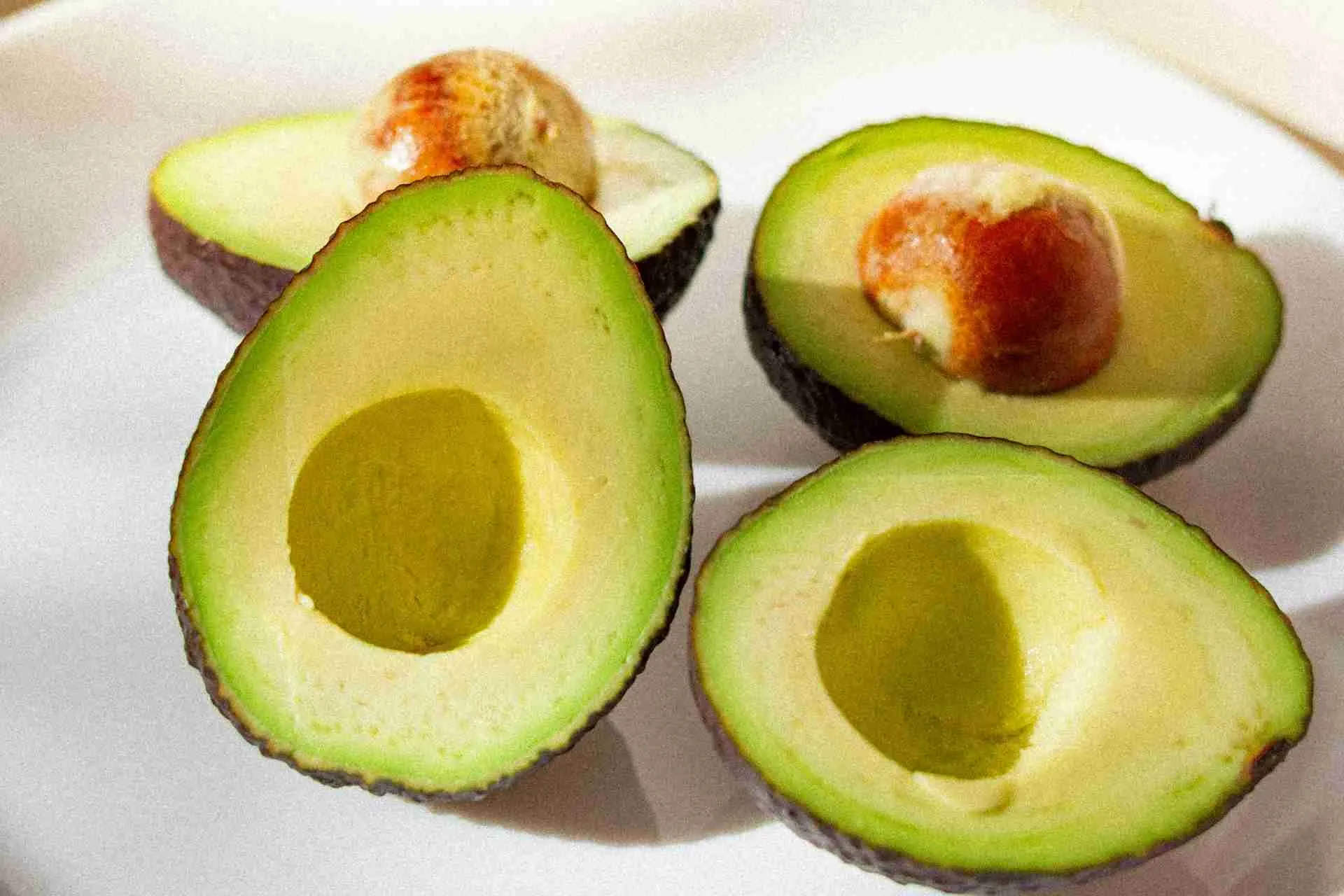 Two Avocados Cut in Half