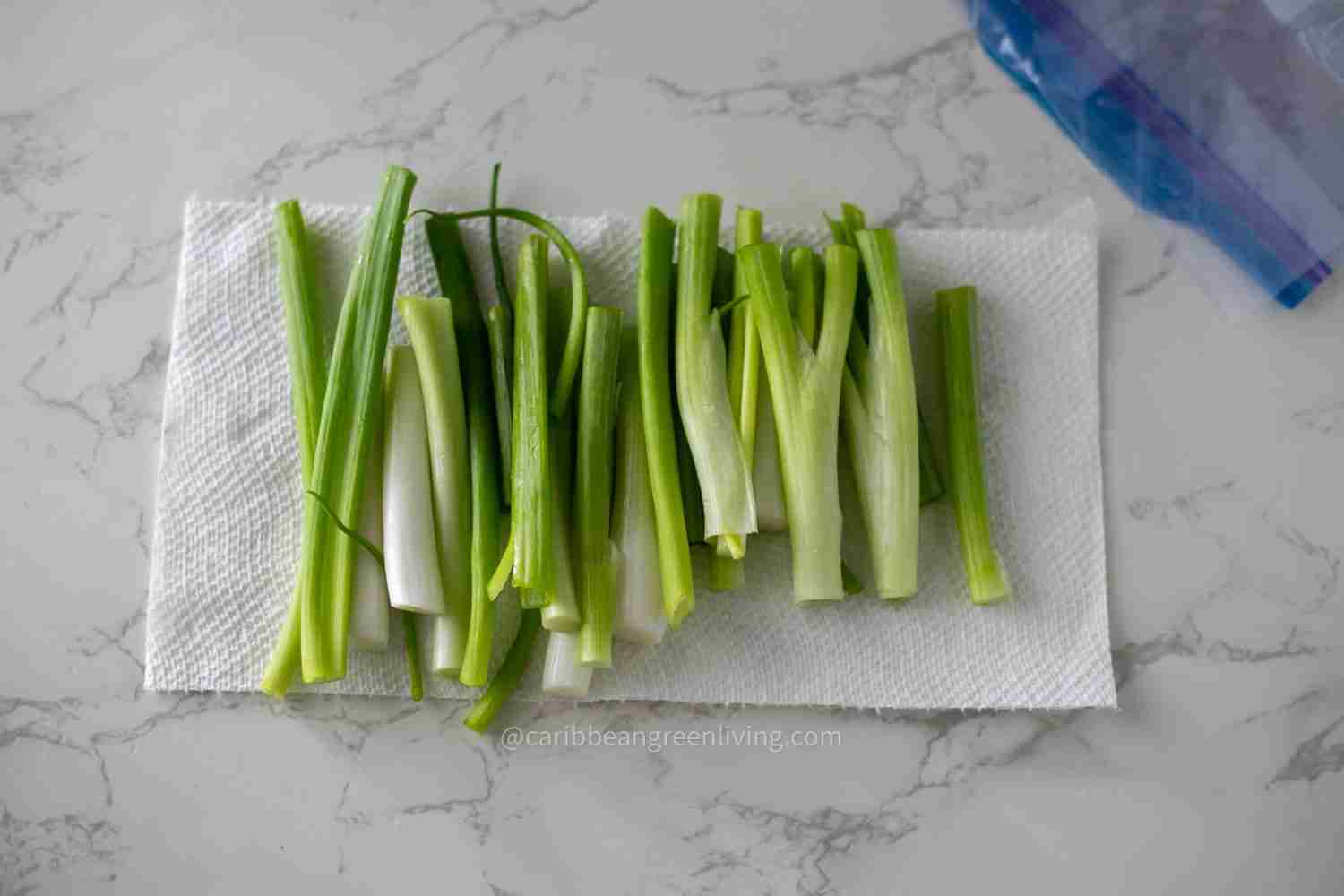 scallions on paper towel